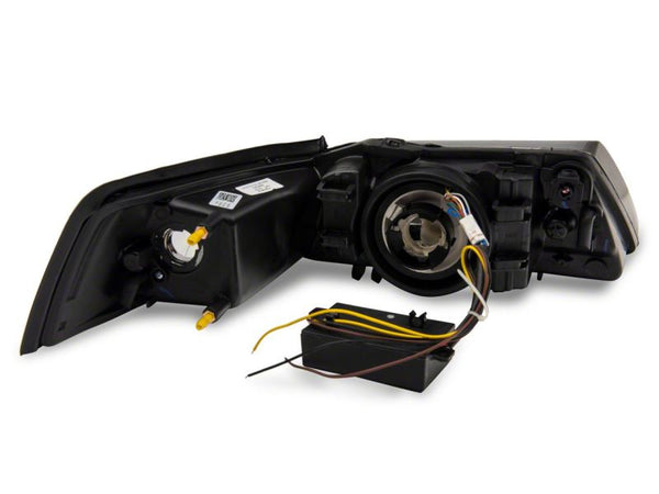 Raxiom 1999 - 2004 Ford Mustang Axial Series Headlights w/ Sequential LED Bar- Black Housing (Clear Lens)