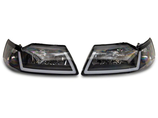 Raxiom 1999 - 2004 Ford Mustang Axial Series Headlights w/ Sequential LED Bar- Black Housing (Clear Lens)