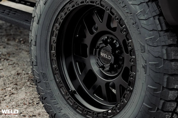 Weld Off-Road W105 17X10 Cinch 6X135 / 6X139.7 ET-25 BS4.50 Satin Black MIL / Gloss Black 106.1