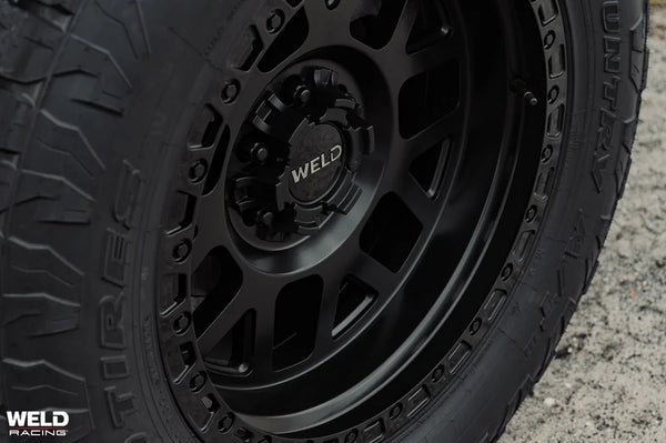 Weld Off-Road W105 17X10 Cinch 6X135 / 6X139.7 ET-25 BS4.50 Satin Black MIL / Gloss Black 106.1