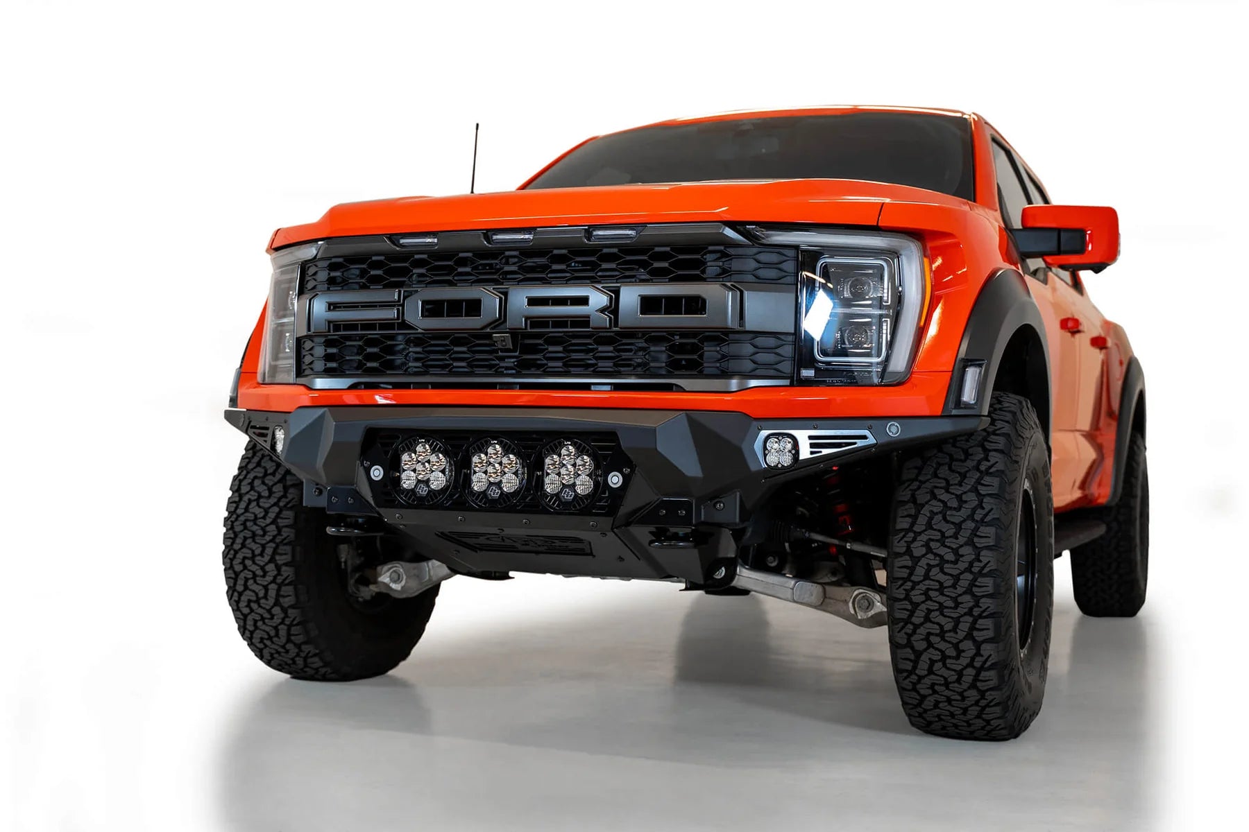 Addictive Desert Designs 2021+ Ford F-150 Raptor Bomber Front Bumper w/ 3 Baja Designs LP6 Light Mounts