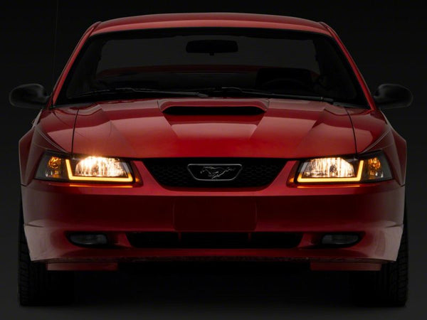 Raxiom 1999 - 2004 Ford Mustang Axial Series Headlights w/ Sequential LED Bar- Black Housing (Clear Lens)